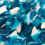 Blue and white shark-shaped gummy candies
