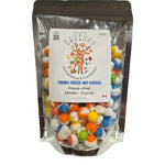 Packaged freeze-dried Skittles in a clear bag with a visible brand label on a white background